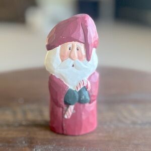 Hand carved Vintage Santa holding candy cane